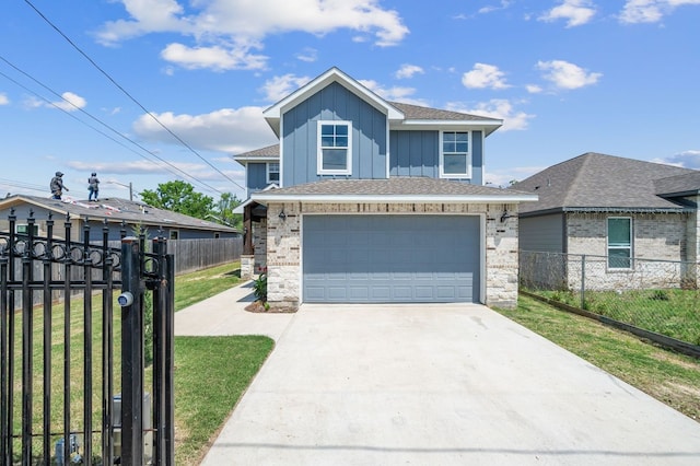 view of front of home featuring a garage and a front yard