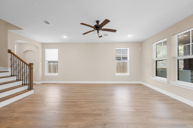 unfurnished room featuring light hardwood / wood-style flooring and ceiling fan