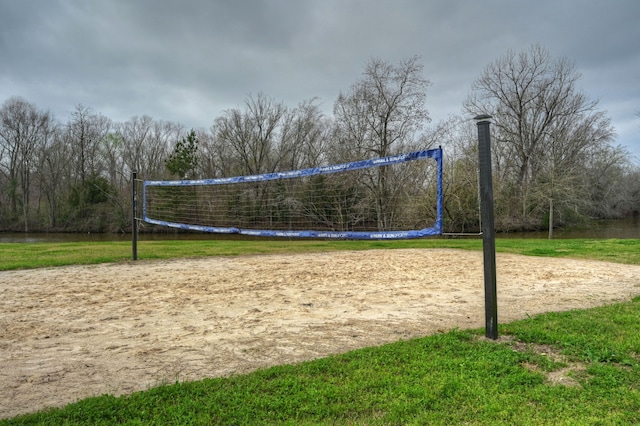 view of community featuring a lawn and volleyball court