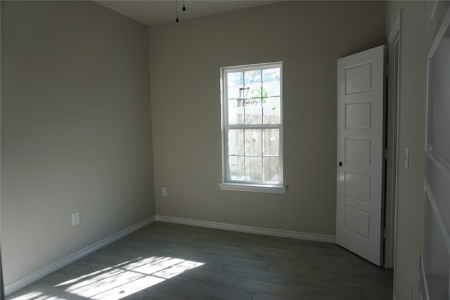 empty room featuring hardwood / wood-style floors and ceiling fan