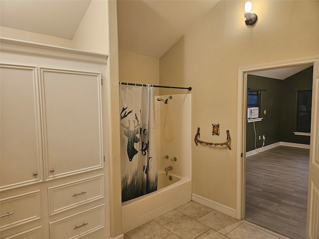 bathroom featuring lofted ceiling, shower / tub combo, and hardwood / wood-style flooring