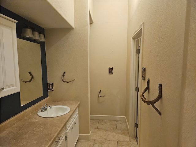 bathroom with tile patterned floors and vanity