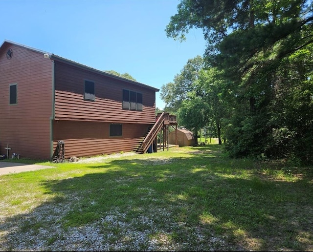 rear view of property featuring a lawn