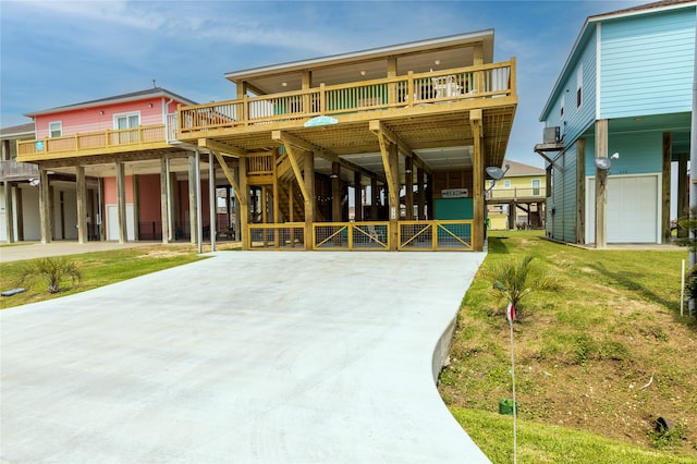 coastal inspired home with a front yard and a garage