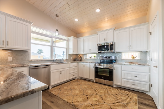 kitchen with sink, stainless steel appliances, and white cabinets