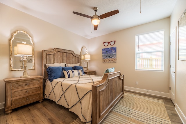 bedroom featuring ceiling fan and hardwood / wood-style flooring