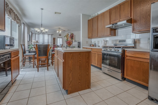 kitchen featuring a kitchen island, light tile patterned floors, stainless steel appliances, ventilation hood, and decorative light fixtures