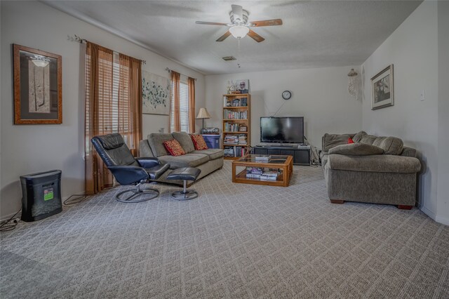 carpeted living room featuring ceiling fan