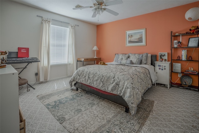 bedroom featuring ceiling fan and light colored carpet