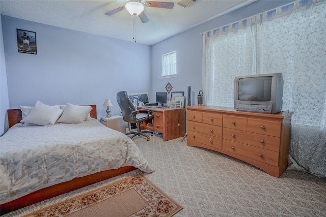 bedroom with light carpet and ceiling fan