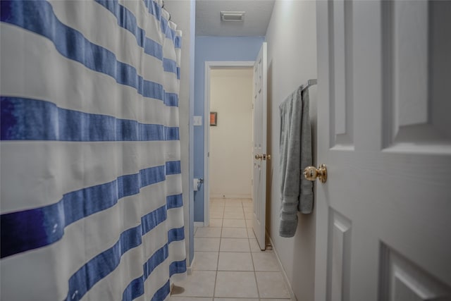 bathroom with tile patterned flooring