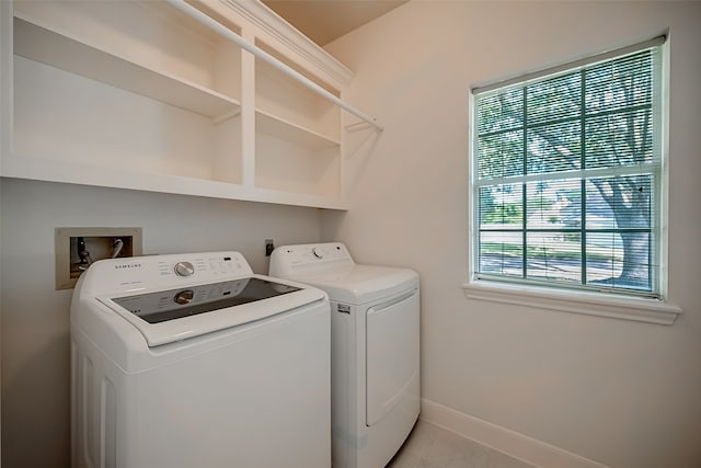 laundry area with washing machine and clothes dryer