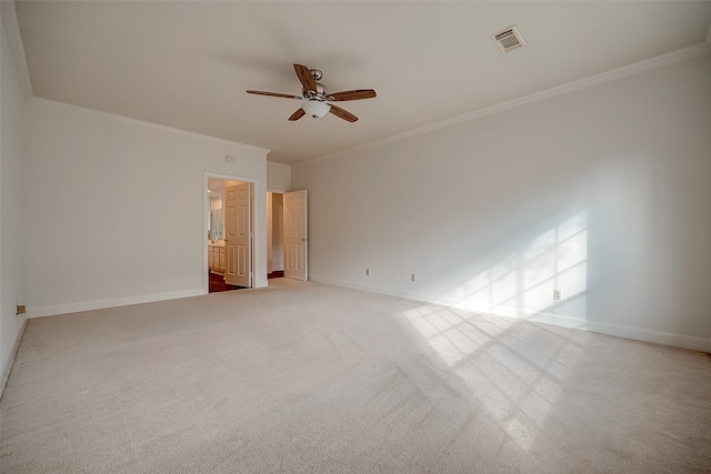 carpeted spare room featuring ornamental molding and ceiling fan