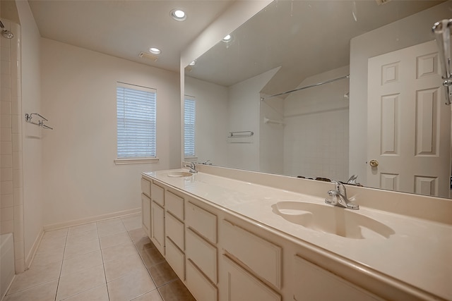 bathroom with vanity, tile patterned floors, and a shower