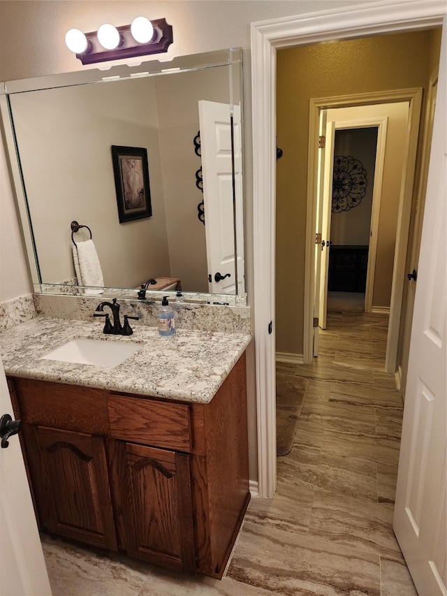 bathroom featuring vanity and hardwood / wood-style floors