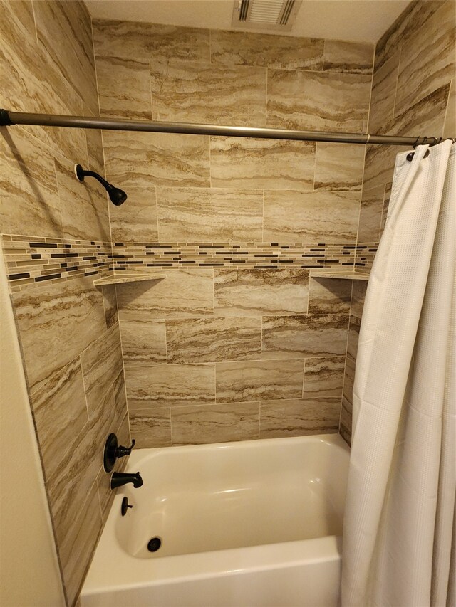 bathroom featuring shower / bath combination with curtain