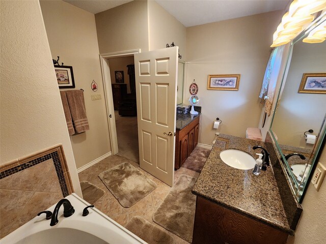 bathroom featuring a bath and vanity