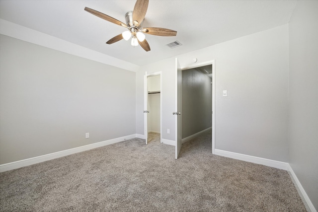 unfurnished bedroom featuring carpet, a closet, and ceiling fan