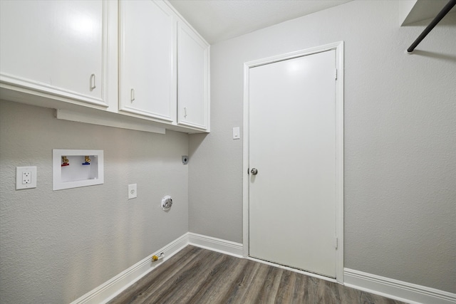 washroom with hookup for a gas dryer, electric dryer hookup, dark hardwood / wood-style floors, hookup for a washing machine, and cabinets