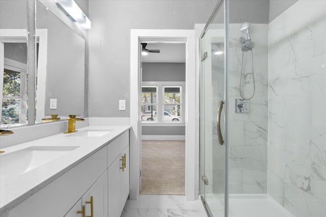 bathroom featuring plenty of natural light, walk in shower, vanity, and ceiling fan