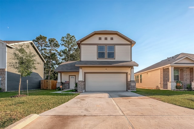 view of front of home with a front yard and a garage