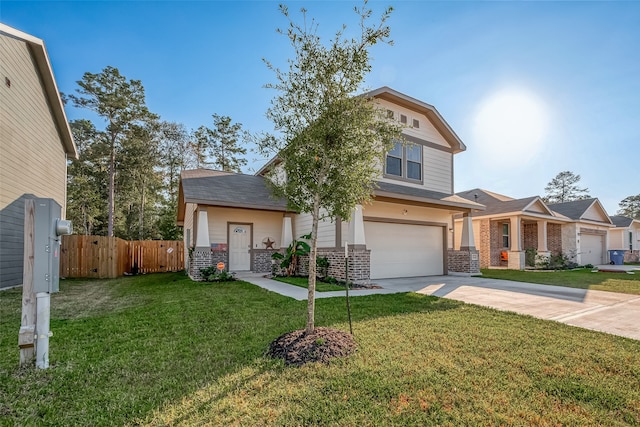 view of front of house featuring a front yard and a garage