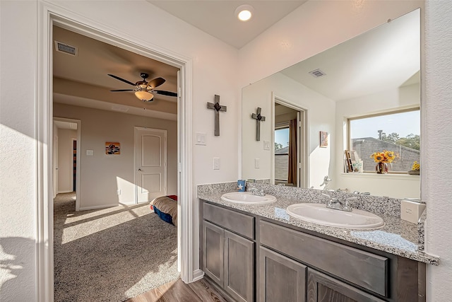 17624 Cedar Crest Dr, Conroe, TX 77306 - full bathroom featuring double vanity, wood finished floors, and a ceiling fan