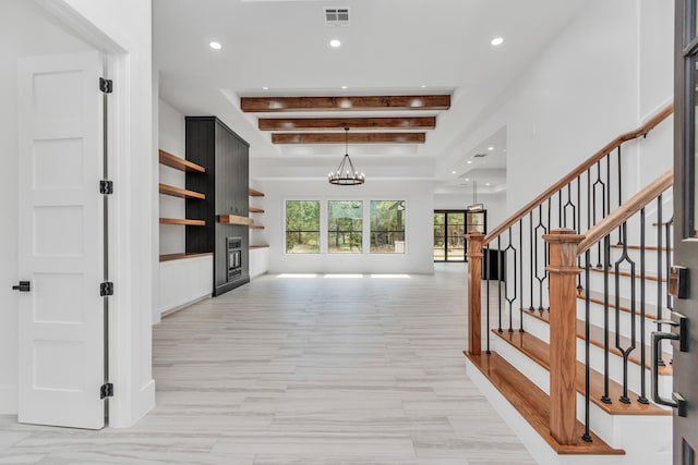 corridor featuring beamed ceiling, light hardwood / wood-style flooring, and a notable chandelier