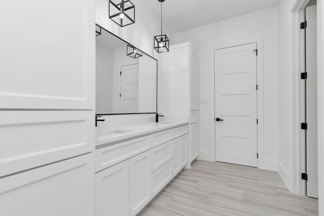 bathroom featuring hardwood / wood-style floors and vanity