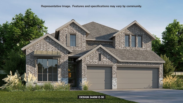 view of front of home featuring a front lawn and a garage