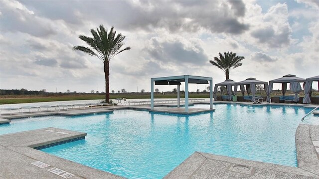 view of pool featuring a patio and a gazebo