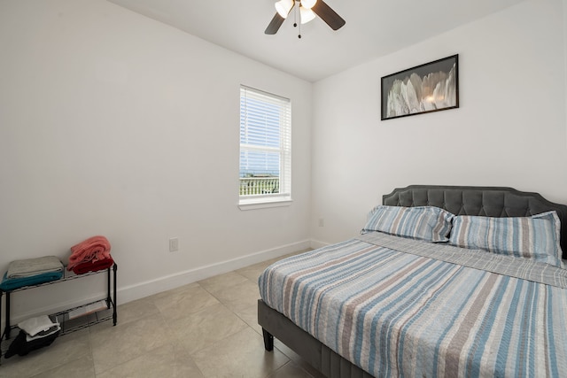 tiled bedroom with ceiling fan