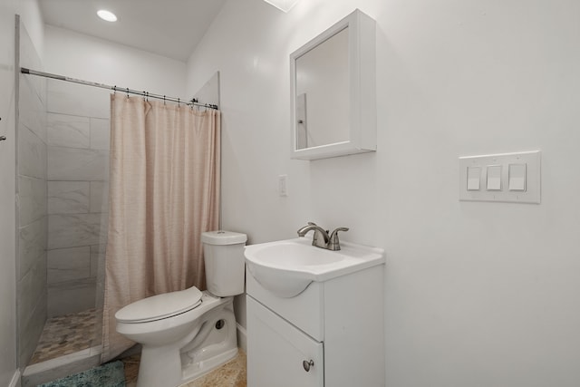 bathroom featuring walk in shower, vanity, and toilet