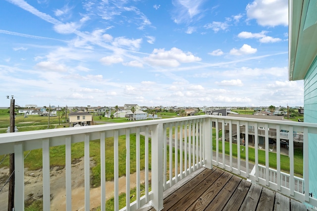 wooden deck featuring a yard