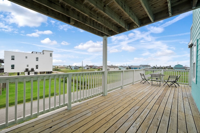 deck featuring a lawn