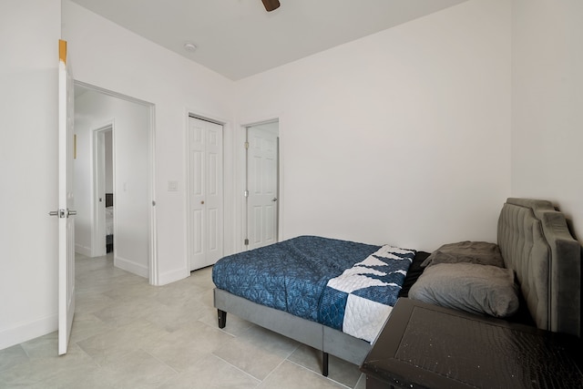 bedroom with light tile patterned floors and ceiling fan