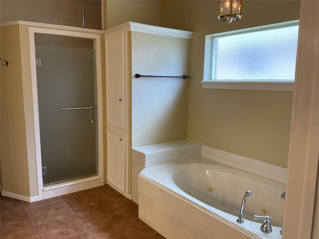 bathroom featuring tile patterned flooring and plus walk in shower