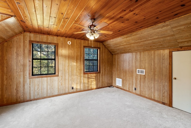 bonus room with wood ceiling, lofted ceiling, wood walls, and carpet flooring