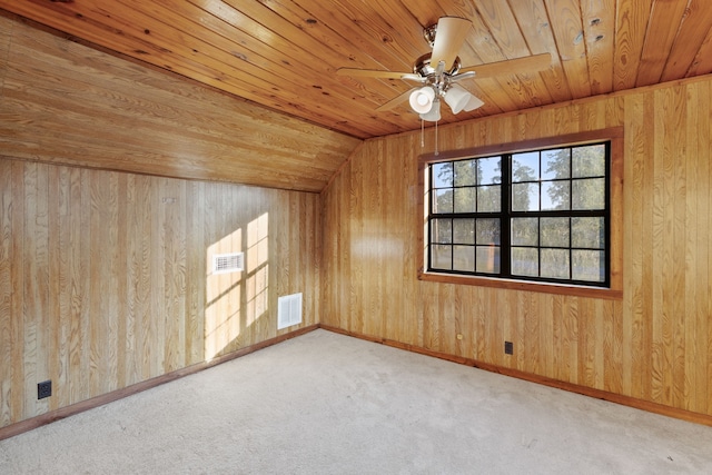 bonus room featuring lofted ceiling, wood walls, and wooden ceiling