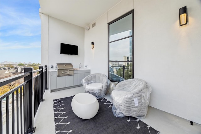 balcony with a grill and sink