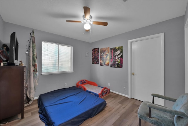 bedroom featuring ceiling fan and light hardwood / wood-style floors