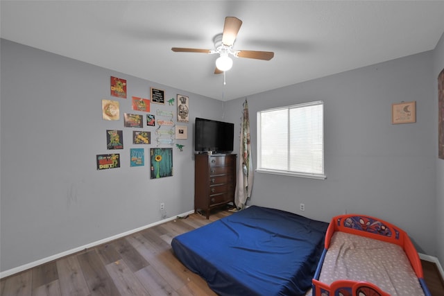 bedroom featuring ceiling fan and hardwood / wood-style floors