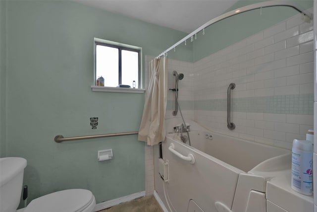 bathroom with separate washer and dryer, shower / tub combo with curtain, and toilet