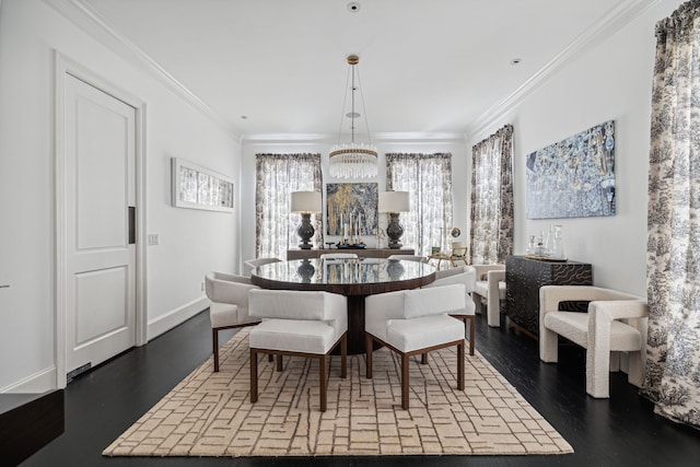 dining room featuring crown molding, a notable chandelier, and wood-type flooring