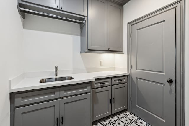 kitchen with gray cabinets and sink