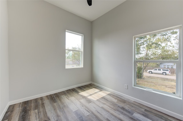 unfurnished room with light wood-type flooring