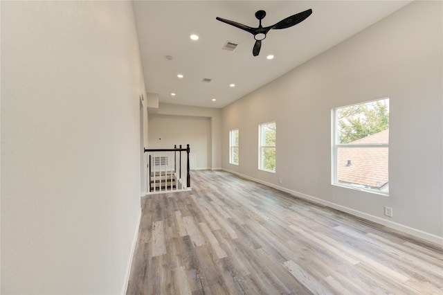 unfurnished room featuring ceiling fan and light hardwood / wood-style floors