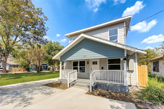 bungalow-style house featuring a front yard and a porch