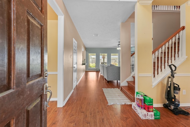 entryway with ceiling fan and hardwood / wood-style floors