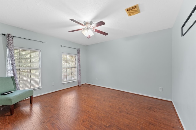 unfurnished room featuring wood-type flooring and ceiling fan